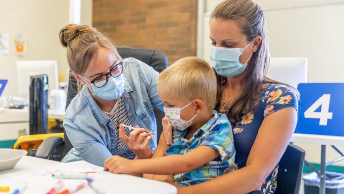 52259042146_5793b84611_k Photo of a child receiving a vaccination